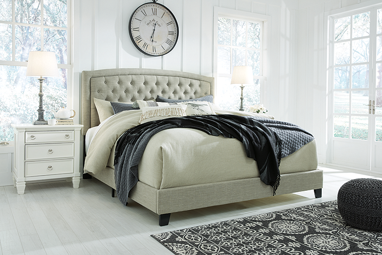 Gray tufted store bed